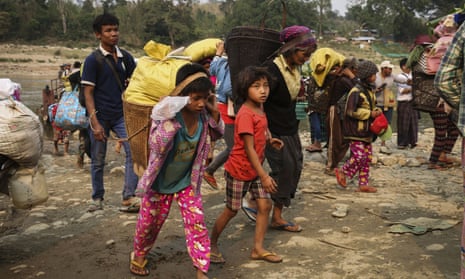 Kachin residents flee the fighting between the Myanmar army and ethnic insurgents.