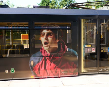 Liam Gallagher’s image on the side of a tram heading to Heaton Park.