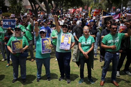 people hold signs that read ‘free David Huerta’