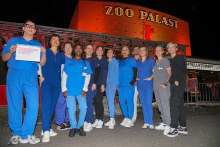 Nursing staff from various hospitals in Berlin demonstrate in front of the Zoo Palast on the fringes of the premiere of Heldin in February.
