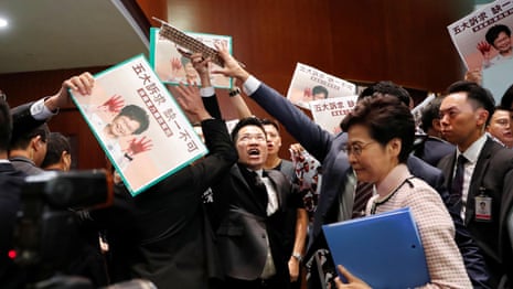 'Carrie Lam step down!' Hong Kong leader heckled in Legislative Council – video