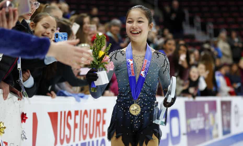 Alysa Liu greets fans while wearing her gold medal after winning the women’s title at the US figure skating championships