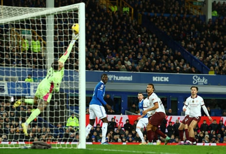 Manchester City's keeper Ederson saves from Everton's Jack Harrison.