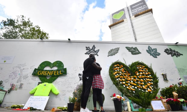 People at the Grenfell Memorial Community Mosaic on the third anniversary of the fire that claimed 72 lives on 14 June 2017. 