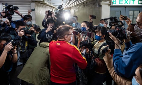 Ronson Chan talks to members of the press after being taken for questioning by the police in Hong Kong