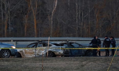 Royal Canadian Mounted Police officers go over a car collision scene involving the fake police car driven by Gabriel Wortman in Shubenacadie, Nova Scotia, Canada, on 19 April. 