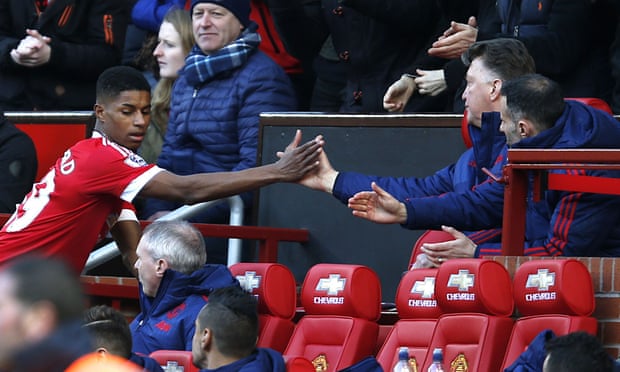 Manchester United's Marcus Rashford is congratulated by Louis van Gaal after leaving the field following the forward's two goals against Arsenal