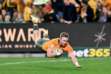 Australia's Ryan Lonergan dives over to score a try.