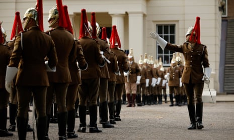 Members of the British military hold a dress rehearsal for the funeral of Queen Elizabeth II at Wellington Barracks in London, England.