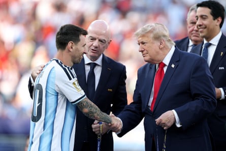 Lionel Messi receives his runner-up medal from Donald Trump.