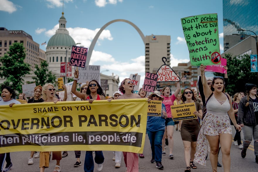 Attendees chant and march through downtown St Louis during a rally and march to protest the closure of the last abortion clinic in Missouri on 30 May 2019.