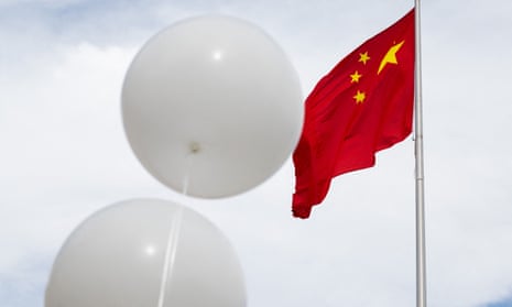 Balloons flown by a human rights protester outside the Chinese embassy in Washington