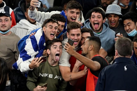 Nick Kyrgios of Australia takes selfies with spectators on John Cain Arena