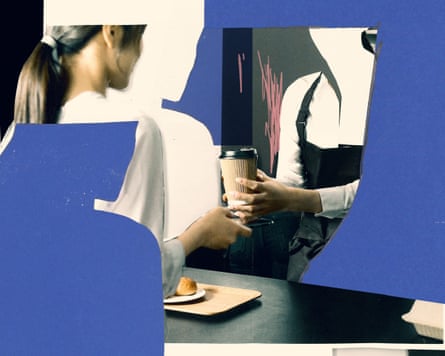 A woman being handed a drink in a paper cup