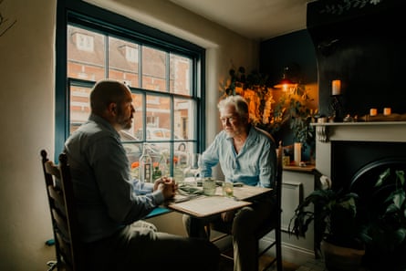 Ben and Neil chatting across a restaurant table