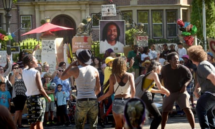 Protesters chant and dance in front of a memorial to Philando Castile on the gates of the governor’s residence in St Paul, Minnesota in July 2016.