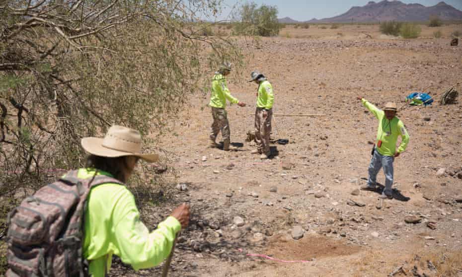 Final journey: search and rescue crew mark off an area where human remains have been found in the wilderness near Ajo, Arizona.