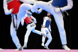 Taekwondo fighters compete