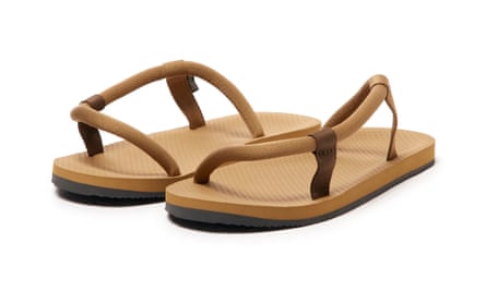 A pair of MontBell ‘Sock-On Sandals’. The sandals are sandy brown with a rope structure.