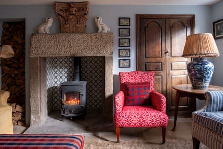 Smart living room with wood burner and antique furniture
