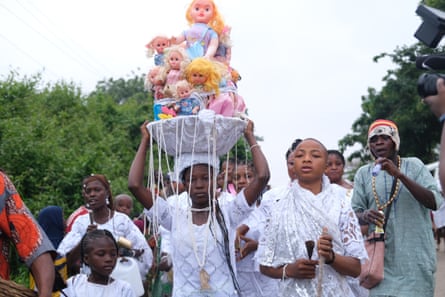 An Osun priestess on her way to the grove.