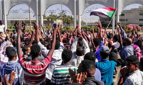 Sudanese protesters outside the presidential residence and military HQ in Khartoum.