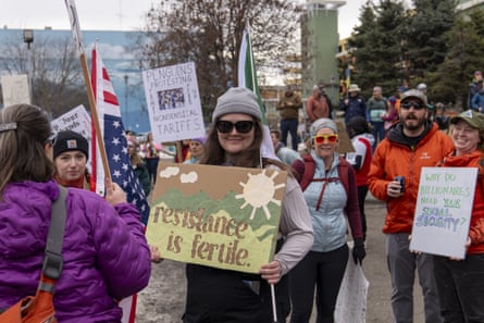 People with signs such as ‘resistance is fertile’ and ‘why do billionaires need your social security?’