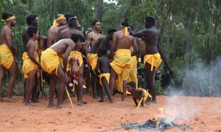 Cedric Marika and a young boy during an interval at the opening ceremony of the Garma festival