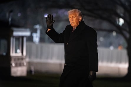 Trump waves after arriving at White House