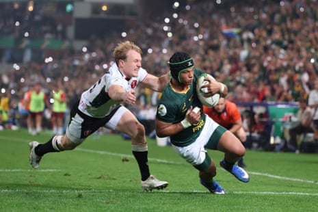 Kurt-Lee Arendse goes past Blair Murray of Wales for the sixth try