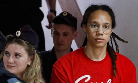 Two-time Olympic gold medalist and WNBA’s Phoenix Mercury Brittney Griner (R) is escorted to a courtroom for a hearing in Khimki City Court.