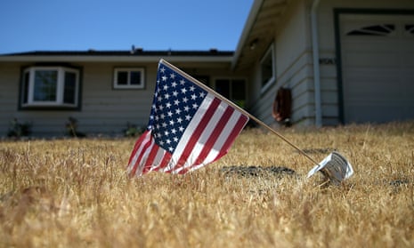 An American flag is displayed in front of a home in Fremont, California