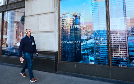 Man walks past skyscraper picture