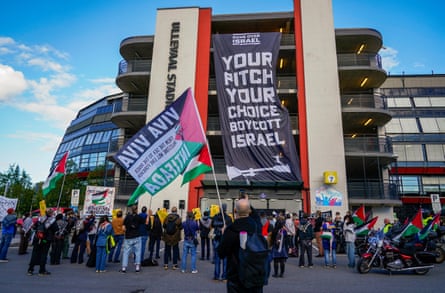 Members of the Action Group for Palestine demonstrate outside the Ullevaal Stadium in Oslo on 17 September.