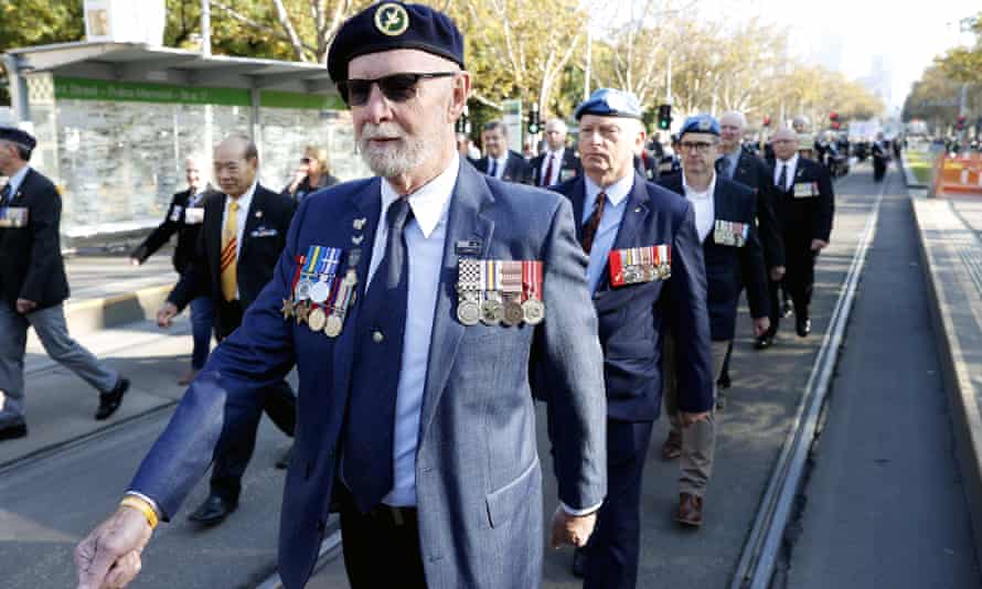 War veterans are seen marching during Anzac Day in Melbourne, Monday, April 25, 2022. (AAP Image/Con Chronis)
