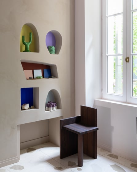 The wall niches in the living room, which make use of bold shapes and colours.