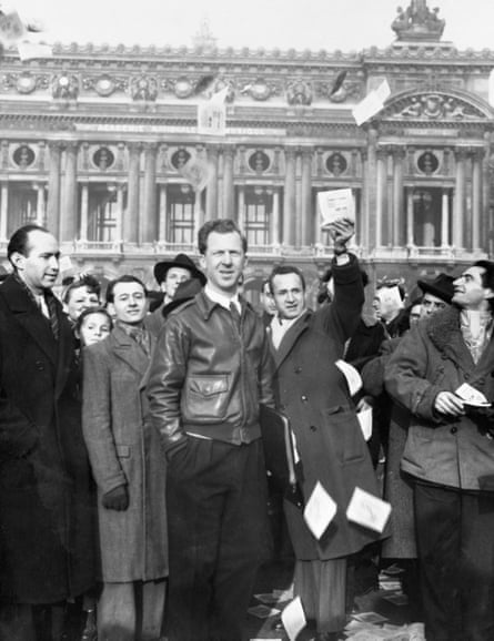 Garry Davis with some of his supporters as they distribute pamphlets in Paris.