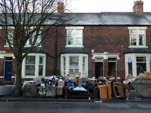 The ruined contents of flooded Warwick Road homes are piled up on the streets