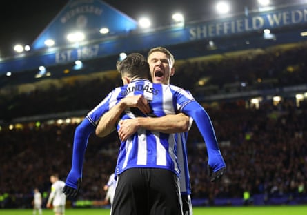 Sheffield Wednesday's Josh Windass is congratulated after scoring the first of his decisive double.
