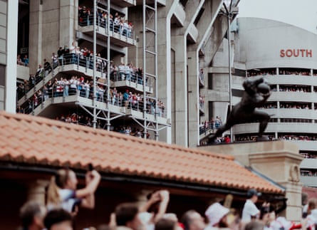 England fans witness the team disembarking at Twickenham before the final