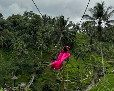A woman in a tropical setting.