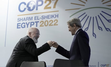 Frans Timmermans, executive vice president of the European Commission, left, fist bumps US climate envoy John Kerry at Cop27