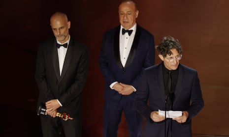 (left to right) James Wilson, Leonard Blavatnik and Jonathan Glazer collect the Oscar for best international film for The Zone of Interest.