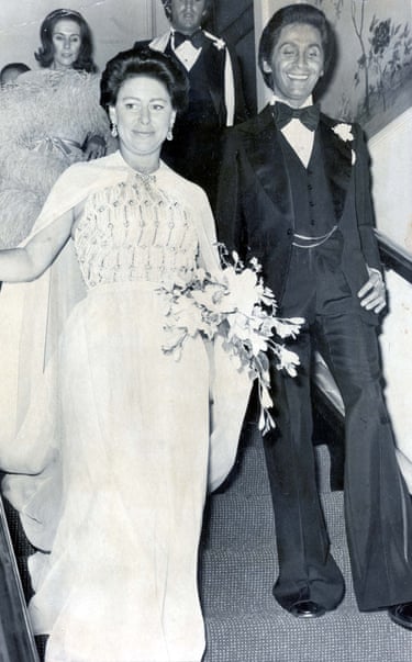 Valentino walks with Princess Margaret down some stairs