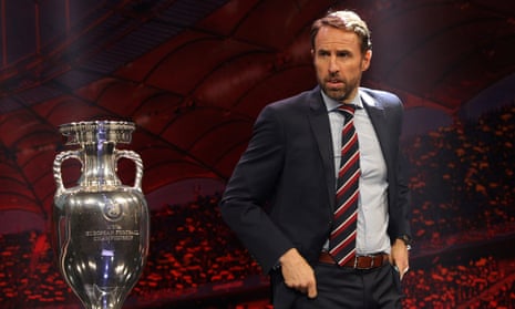 Gareth Southgate next to trophy for the European Championship, which has been delayed.