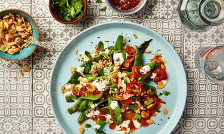 Thomasina Miers’ grilled flat beans with spiced tomato sauce, garlic yoghurt and sweet and salty almonds