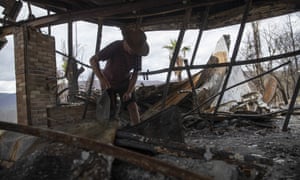 Philip Hine surveys the ruins of his property in Wytaliba, New South Wales