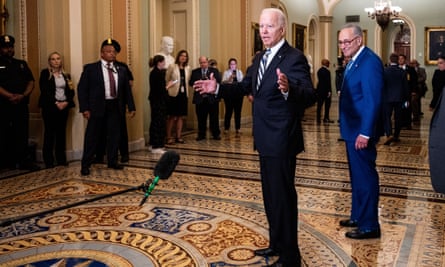 Joe Biden, with the majority leader, Chuck Schumer, visits the Senate, where some of his key legislative objectives have hit a roadblock.