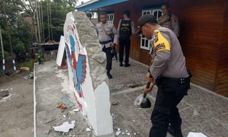 Indonesian authorities dismantling signage at a Free West Papua campaign office in Timika.