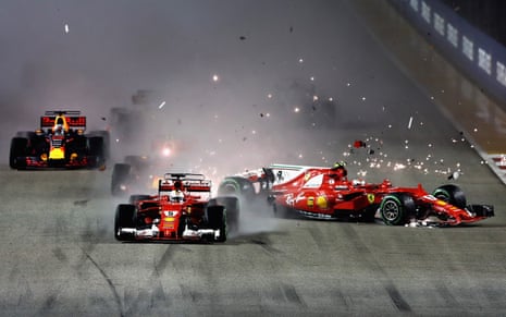Sparks fly as Sebastian Vettel and Kimi Räikkönen collide at the start of the 2017 Singapore GP